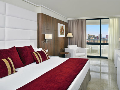 A king room with a balcony that overlooks the city at Melia Benidorm in Benidorm