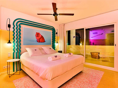 A double room with a large balcony and funky decor at Paradiso Ibiza Art Hotel in Ibiza