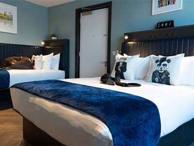 A double bed and a single bed in a room at Dublin One Hotel