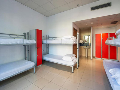 A room with several bunkbeds in it at Safestay Barcelona Passeig De Gracia