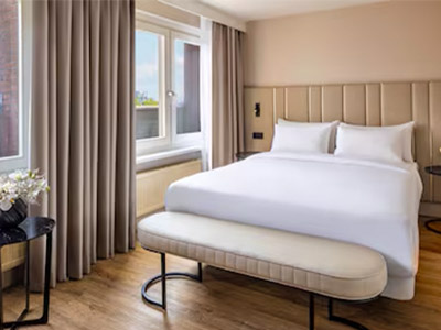 A double bed in a room at H Amsterdam Leidseplein