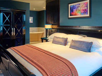 A king bed in a room at Malmaison in Aberdeen