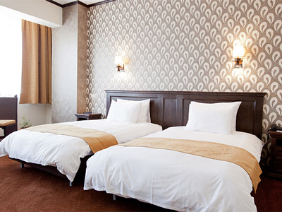 Two beds side by side at Hotel International Bucharest