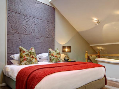 An apartment room at Oddfellows in Chester with a double bed 