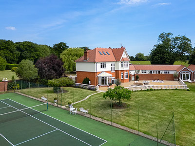 Merry House complete with large grounds and a tennis court 