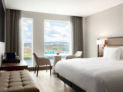 A double room at AC Marriott Hotel Belfast which is bright, spacious with floor to ceiling windows overlooking the river 