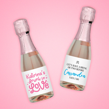 Three mini Prosecco bottles with pink foil all emblazoned with personalised hen party labels