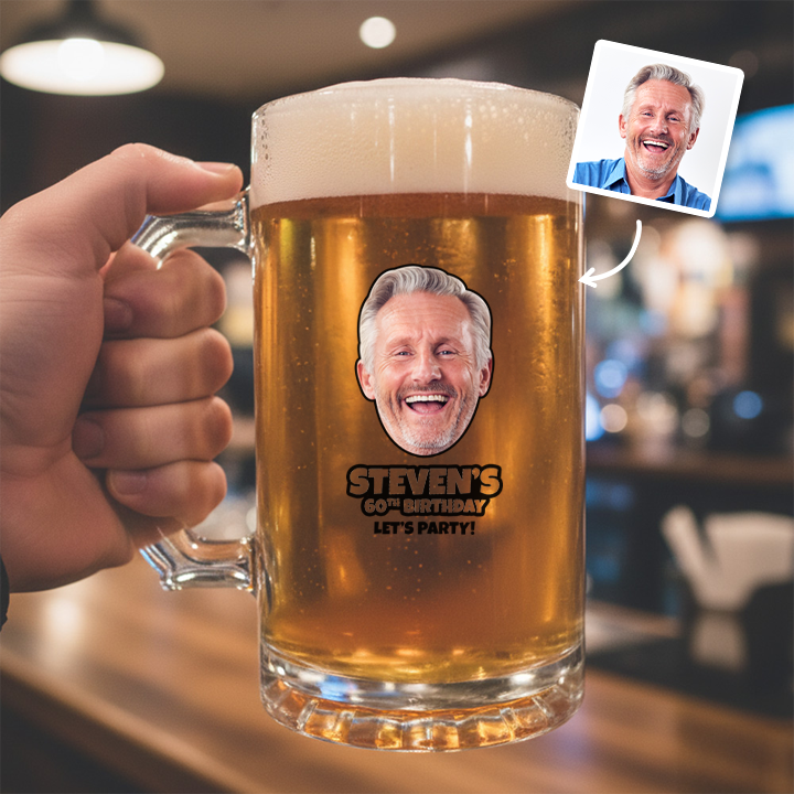 A custom Kronenbourg-inspired birthday stein with frosted glass that reads Joseph 1664 with a pub background