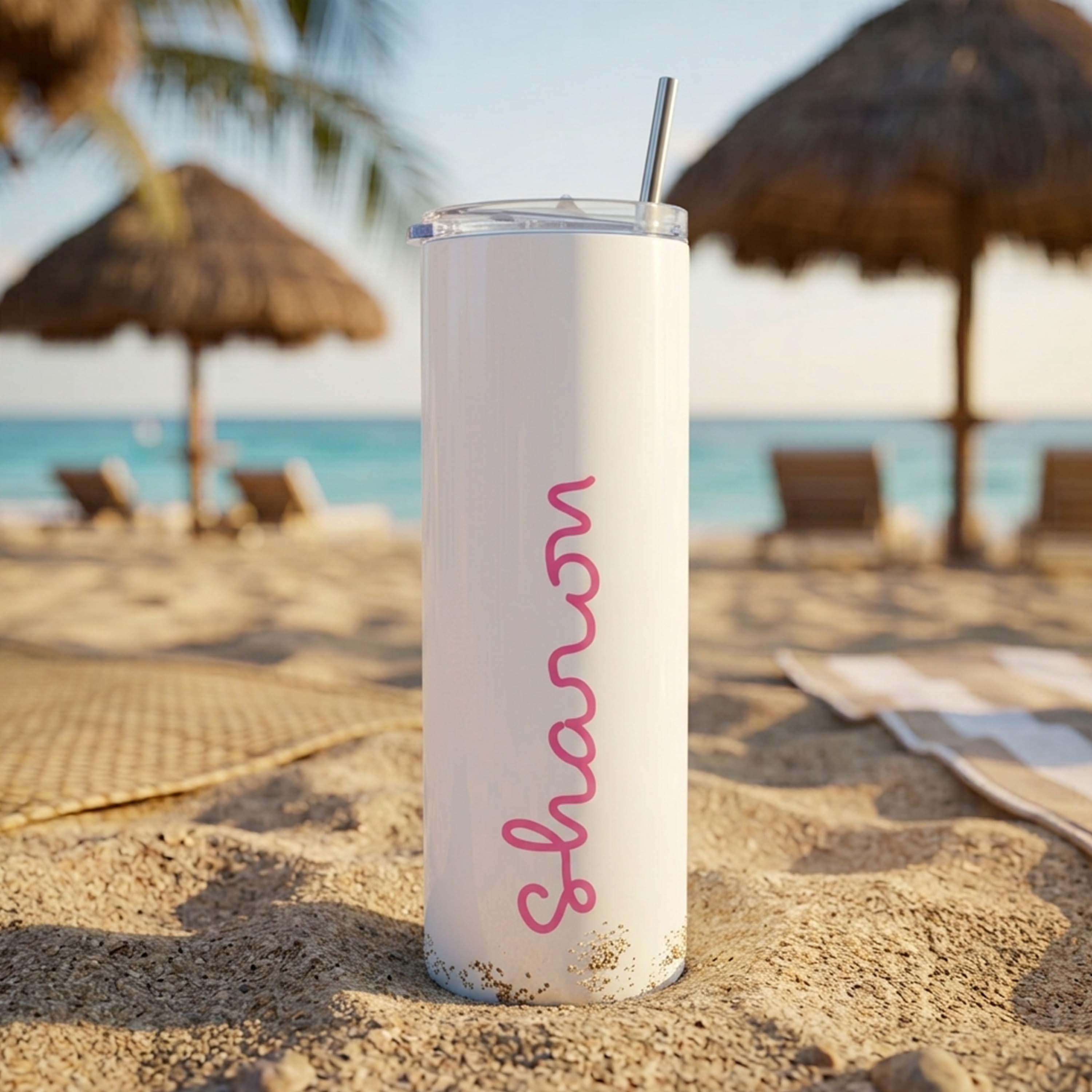 A Love Island inspired Like Island white waterbottle in a tumbler style with the custom text Sharon printed on it in a curly pink font with a beach background