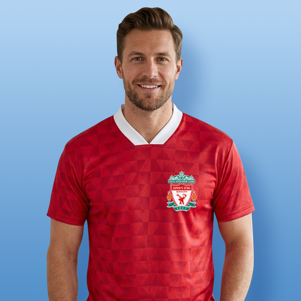 A male model wearing a custom Liverpool FC themed football shirt that has a retro red shimmer and a Liverpool style crest and custom text Jamie's Stag, Benidorm, 2027 