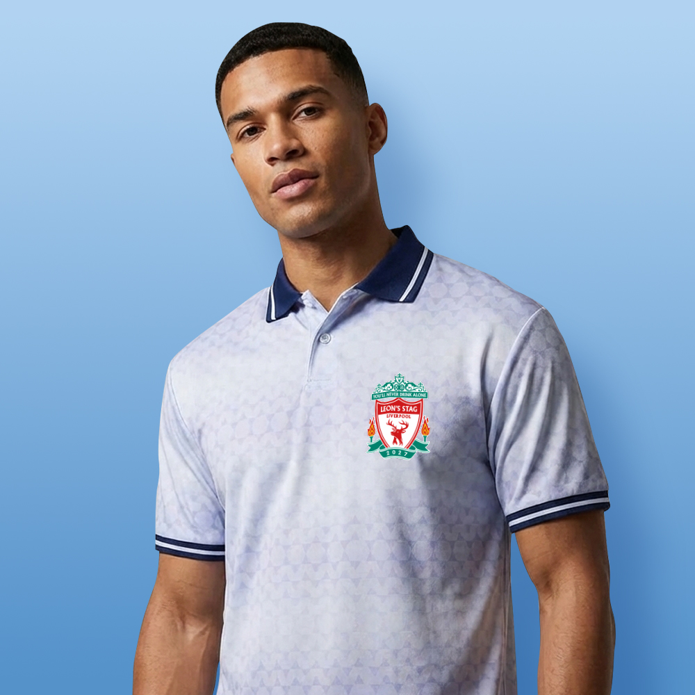 A male model wearing a custom Liverpool FC themed football shirt that has a retro white shimmer and a Liverpool style crest and custom text Leon's Stag Liverpool, 2027