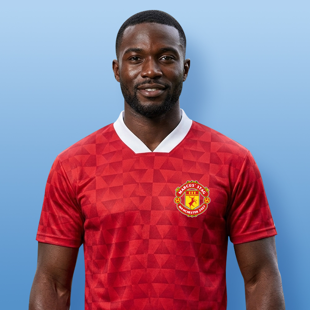 A male model wearing a custom Manchester United themed football shirt with a retro red shimmer which has been personalised with the custom text Marcus' Stag Manchester 2027 