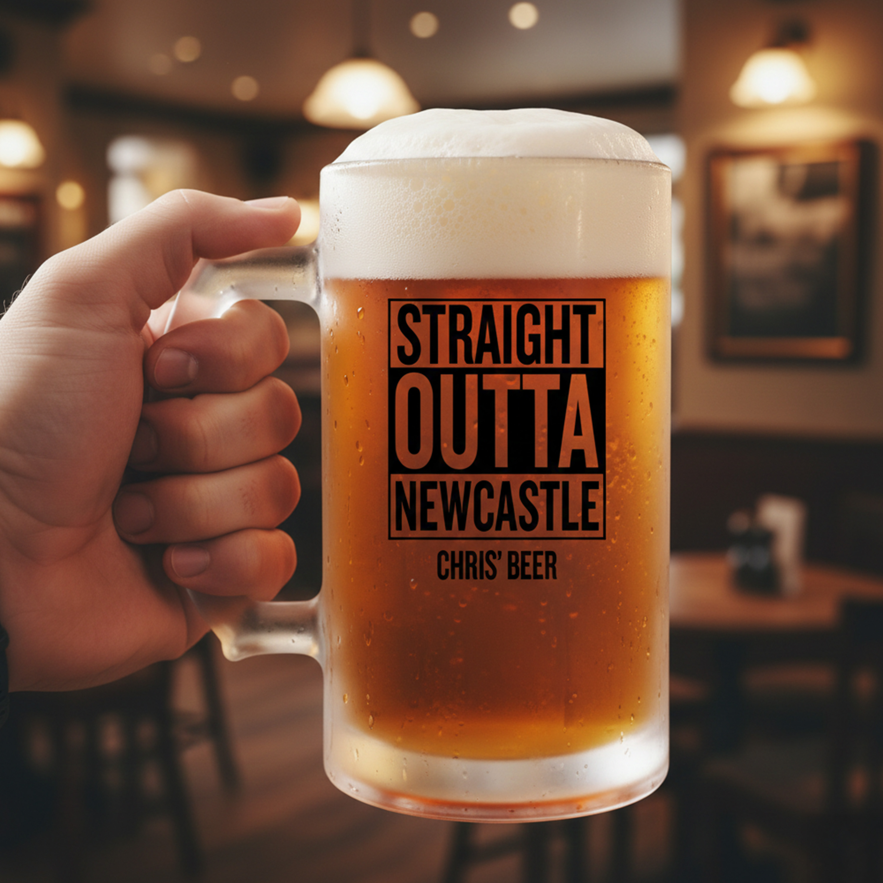 A custom Straight Outta Compton themed stein with clear glass which reads Straight Outta Newcastle Chris' Beer with a pub background