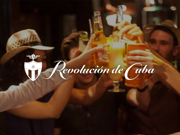 People partying and a man playing a trumpet at Revolución de Cuba Liverpool