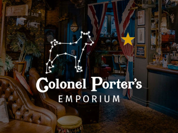 Interior of Colonel Porters, tables and booths with extravagant décor and light fixtures