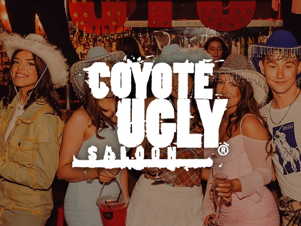 A girl dancing on a bar with a lit 