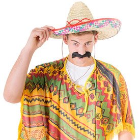 A model wearing a poncho and a sombrero, holding the brim of his hat