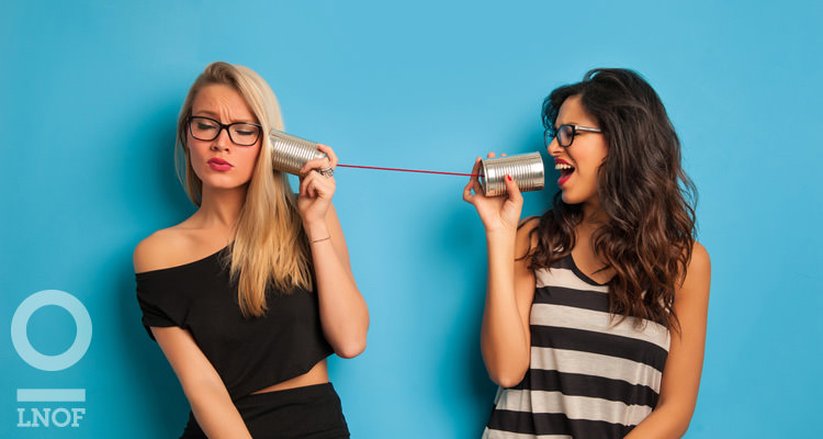 Women talking on a string phone