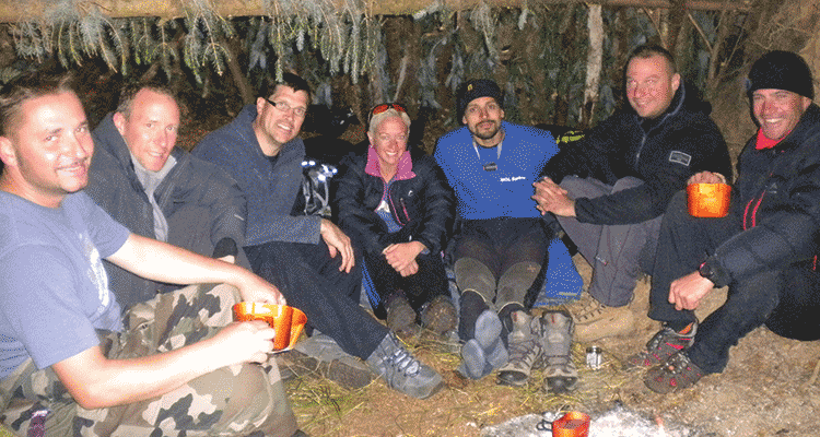 People sitting around a campfire