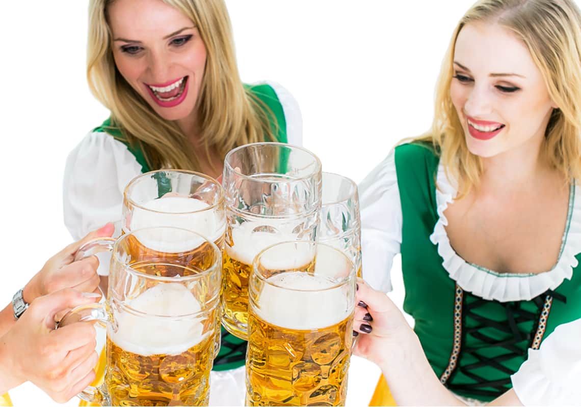 Bavarian girls clinking glasses