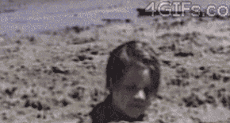 boy buried in sand