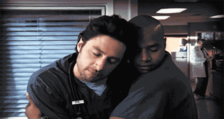 two men cuddling each other