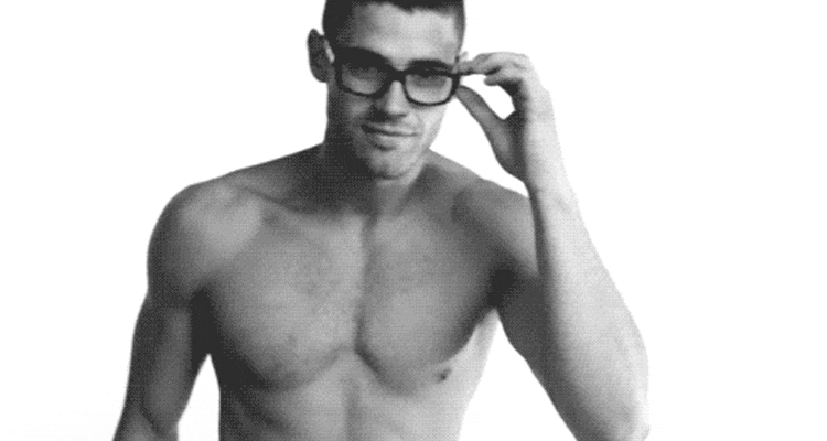 A semi-naked man in glasses