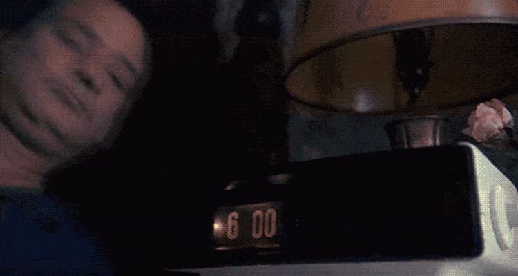 A man hitting an alarm