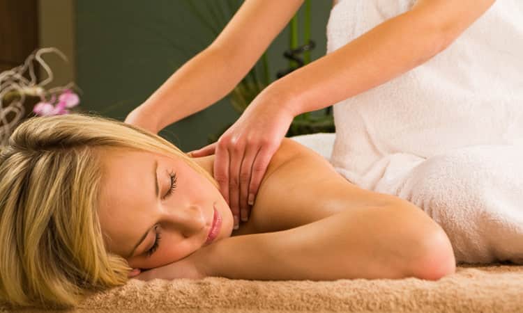 Woman getting a massage at a spa