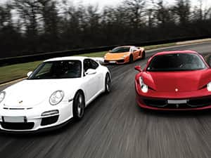 Three supercars racing 