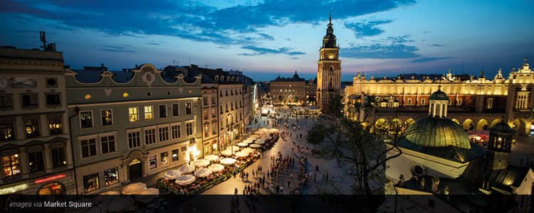 Krakow lit up at dusk, from a bird's eye view