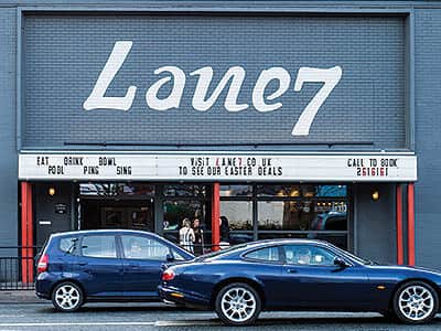 The exterior of Newcastle's Lane 7, with two cars outside