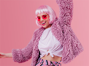 Close up of a woman wearing trainers and reaching down to dance 