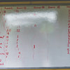A whiteboard with scores on it