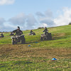 LNOF staff steering quad bikes around a field