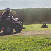 LNOF staff driving quad bikes up a hilly field