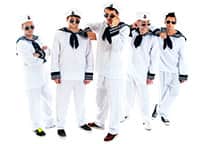 a stag group dressed as sailors, casually tilting down their sunglasses