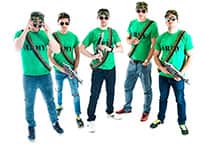 a stag group of five men in bright green army t-shirts, camouflage hats, bullet sashes and aviator sunglasses