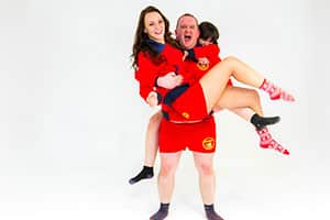 Andrew from sales shows the lifeguard strength in carrying two colleagues to safety