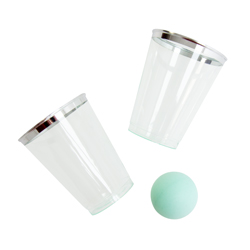 Two Gin Pong cups and a ball against a white background
