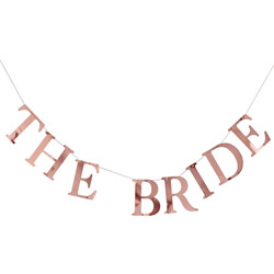 The Bride photo peg bunting hanging up on a panelled wall.