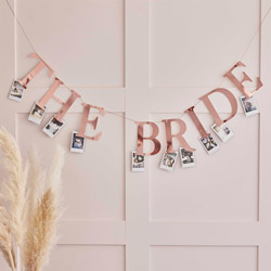 The Bride photo peg bunting isolated on a white background.