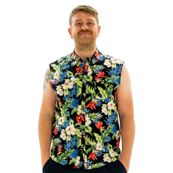 A model wearing Sleeveless Freesia Shirt, smiling and facing the camera with his hands in his pockets.