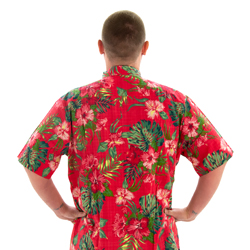 A model wearing Coral Pink Hawaiian Shirt, facing away from the camera with hands on hips.