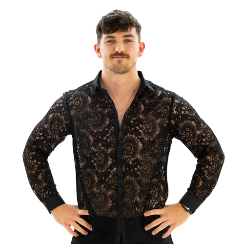A model wearing Cockscomb Lace Shirt, facing the camera with his hands on his hips.