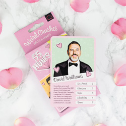 Weird Crushes British Edition card game with David Walliams card on top, surrounded by rose petals.