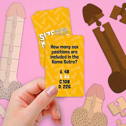 Woman playing Sizes Matters penis party game on a pink background.