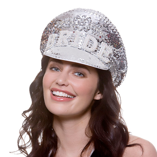 A woman wearing a deluxe bride captain hat smiling at the camera