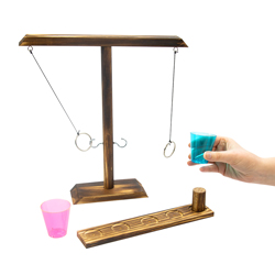 Ring Toss game and person holding a colourful shot glass isolated on white background