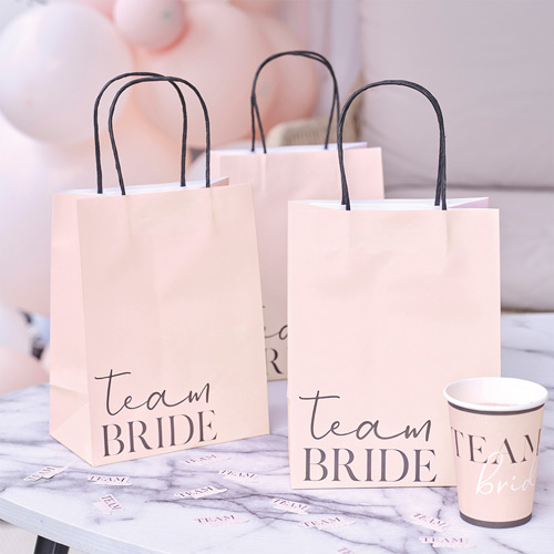 Three gift bags with 'Team Bride' written on the front